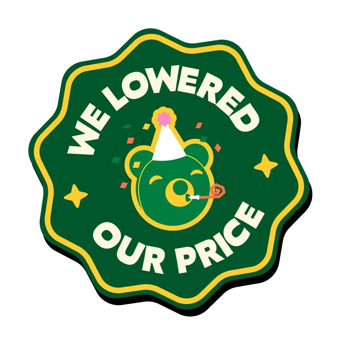 A green scalloped badge reading "We Lowered Our Price" with a bear mascot wearing a party hat and blowing a party horn in the center, decorated with small stars and confetti, on a transparent background.